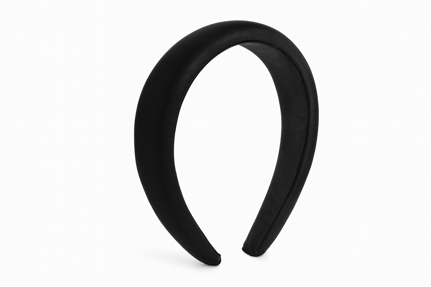 Black padded headband on white background