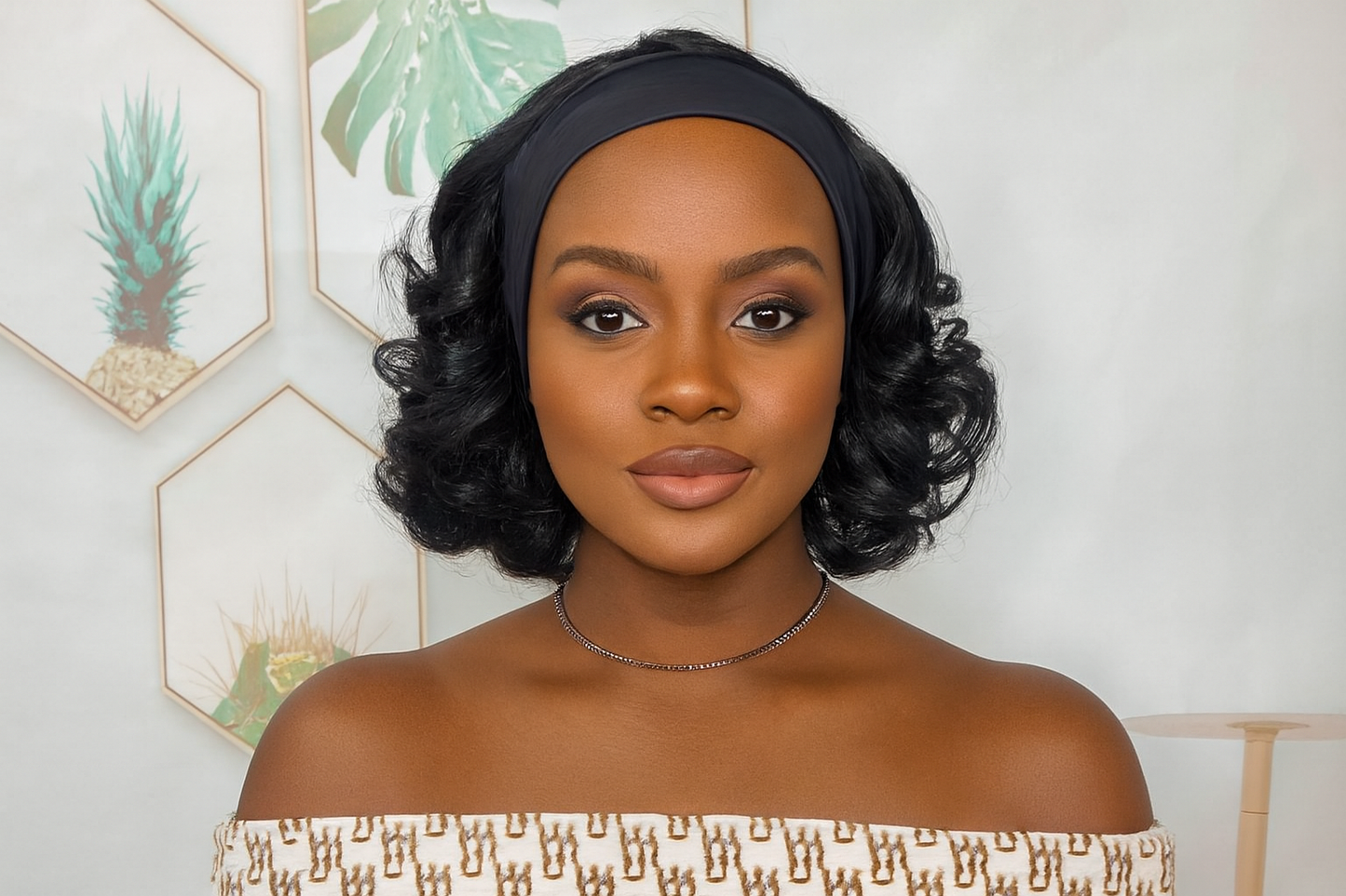 Generated image of a short curly headband wig on a Black woman model