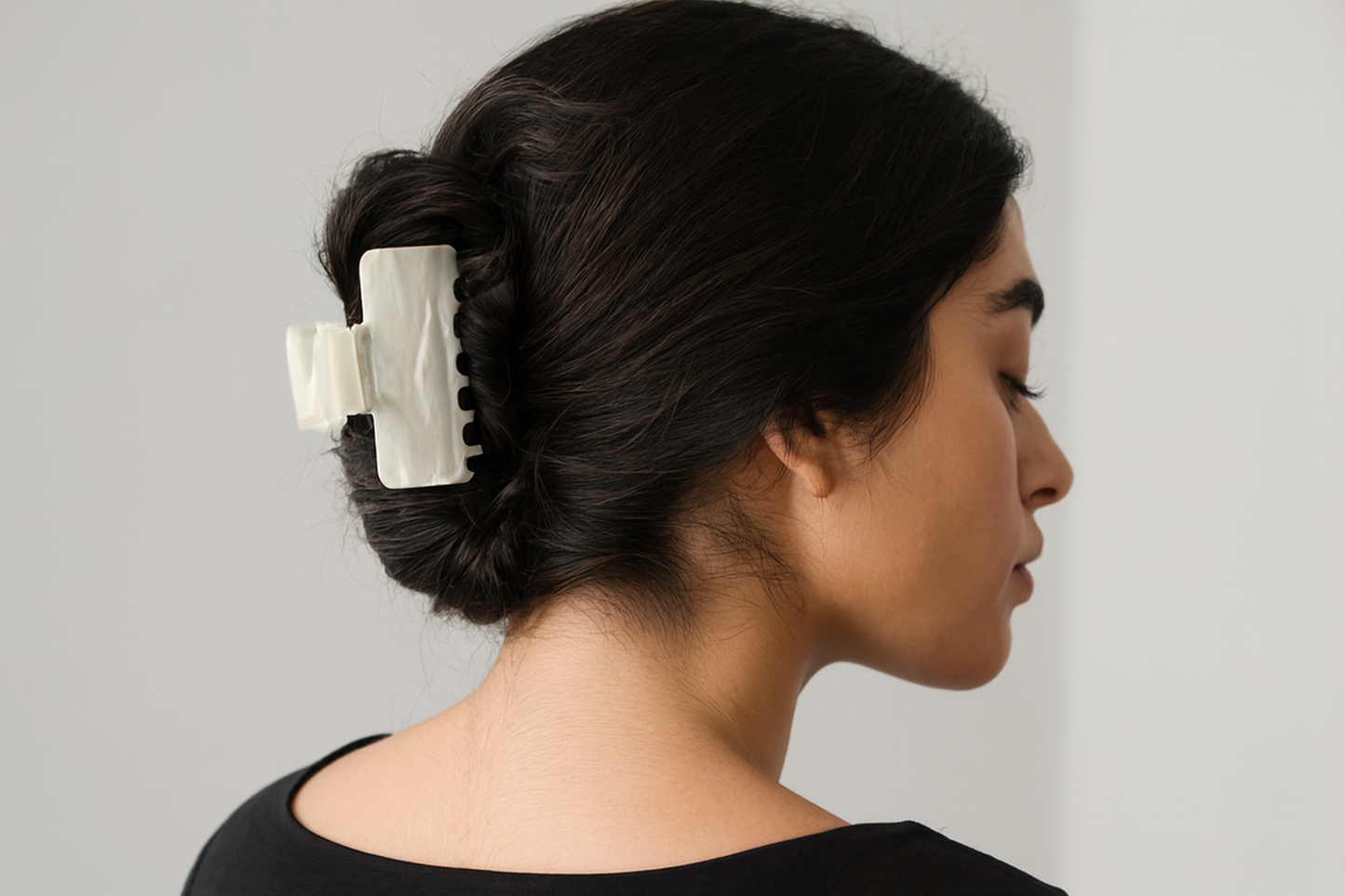 Hair clip on model with thick hair - low bun style