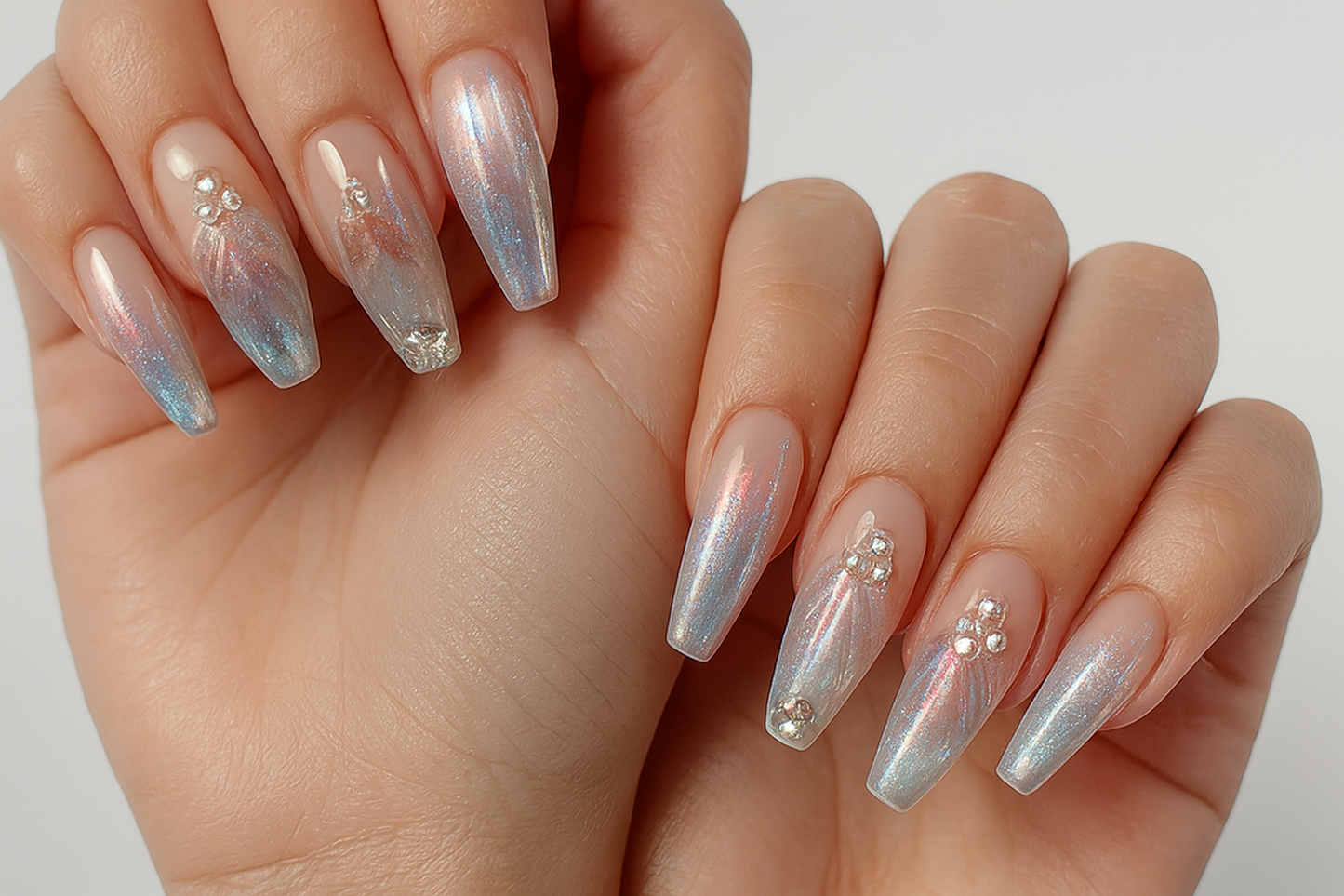 Hand model wearing holographic chrome nails