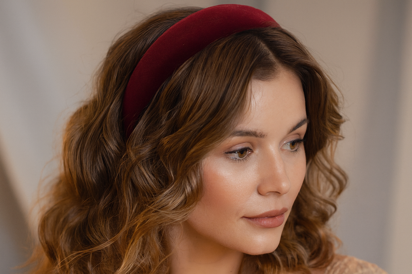 Model with wavy hair wearing headband