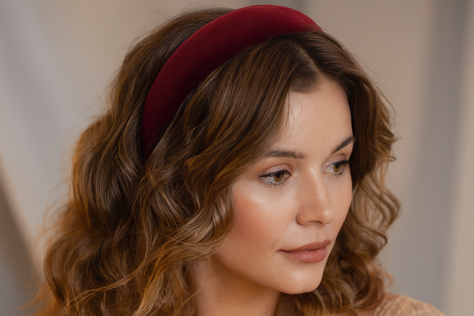 Model with wavy hair wearing headband